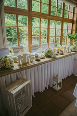 Beautifully decorated wedding table and other details at wedding hall. Wedding day.