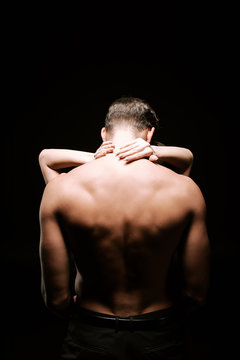 Back View Of Shirtless Man Hugging With Woman Isolated On Black