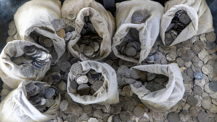 historic cuban money bags with coins