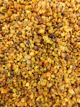 lots of dried raisin grapes for food as a background