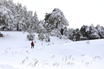 man walking on snowy mountain