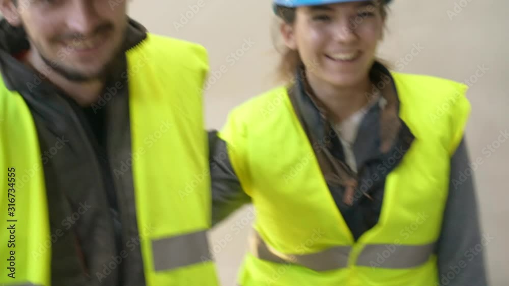 Wall mural Young apprentice with security helmet, isolated on background