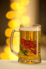 Mug of beer on wooden background