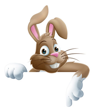 The Easter Bunny peeking over a sign and pointing at it cartoon