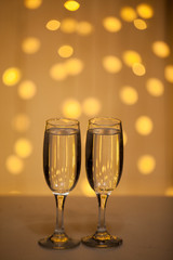 Two glasses of pink champagne for the couple.