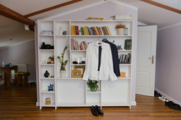 Groom's wedding accessories. Bow tie, suit, cufflinks, belt and shoes.