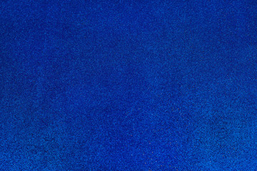 blue glitter background with selective focus.