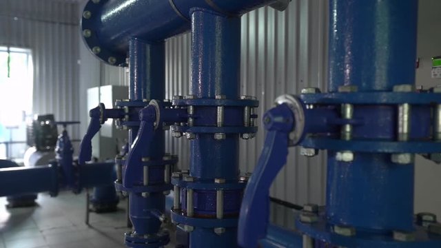 Water valves pipes system condensate equipment at the station of water supply and treatment smooth camera movement