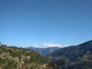 Fototapeta premium Clouds and mountains in Himalayan region of Uttarakhand state of India