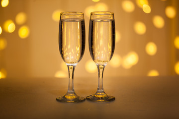 Two glasses of pink champagne for the couple.