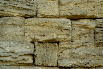 Yellow  brick wall close up
