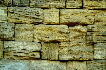 Yellow  brick wall close up