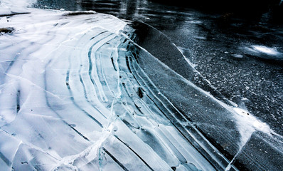 ice structure with beautiful lines on frozen lake
