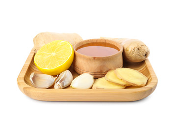 Fresh garlic and other natural cold remedies isolated on white