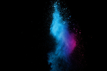 Explosion of colored powder isolated on black background. Abstract colored background. holi festival.