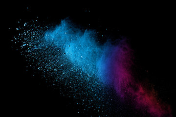 Explosion of colored powder isolated on black background. Abstract colored background. holi festival.
