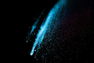 Fototapeta premium Explosion of colored powder isolated on black background. Abstract colored background. holi festival.