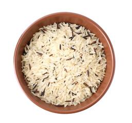 Mix of brown and polished rice in wooden bowl isolated on white, top view