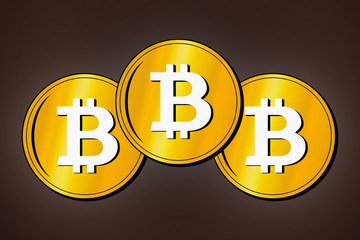 Cryptocurrency Coins. Bitcoin symbol. Three golden bitcoins close-up.