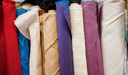 Close-up of rolled fabric cloth bolts