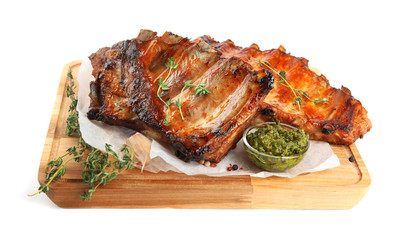 Tasty grilled ribs with sauce isolated on white