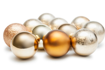 Group of shiny Christmas baubles against white background