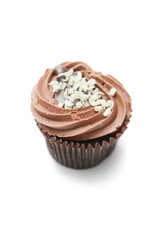 Delicious chocolate cupcake against white background