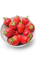 Bowl full of strawberries against white background