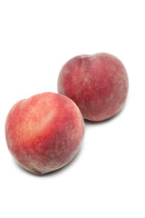 Two peaches against white background
