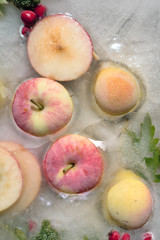Background fresh season apple    frozen in ice