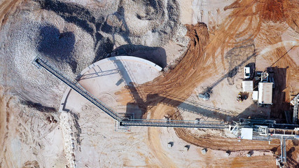 Aerial view of a large Quarry during work hours with Stone sorting conveyor belts
