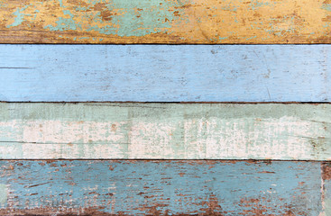 Vintage wood background texture old wood material or Vintage wallpaper colors Patterned of brightly colored panels of weathered painted wooden boards /