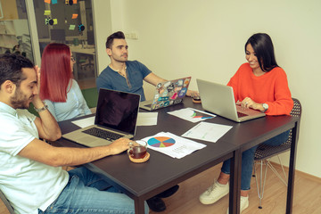 Multiethnic startup business team on meeting in modern office interior
