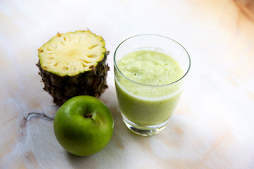 A glass of pineapple and apple juice