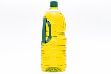 A bottle of yellow salad oil on a white background
