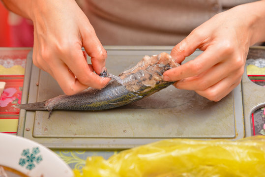 Herring on a cutting board, peeled juicy and oily