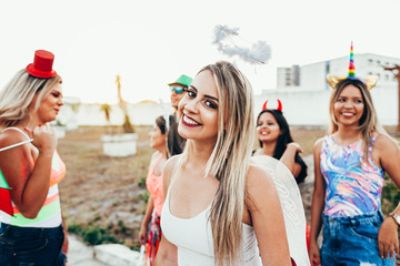 Brazilian Carnival. Group of Brazilian people in costume celebrating the carnival party in the city