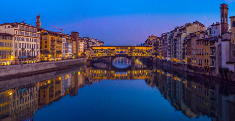The Ponte Vecchio, famous medieval stone bridge over the Arno River in Florence, Tuscany, Italy.