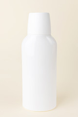 White cosmetic bottle without a label on a light pastel background. Bottle for mockup, copyspace, minimalism. The concept of beauty, cosmetology.