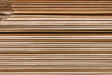 Texture of a large stack of brown paper, background