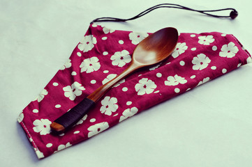 Wooden spoon and chopsticks on wood table