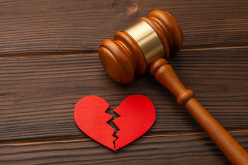 Divorce and division of property. Broken heart and judge gavel