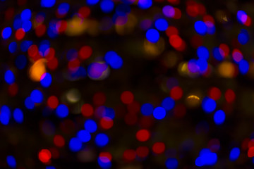 Bokeh and flare of blured background in nightclub. Fresh healthy blue red background with abstract blurred foliage and bright summer sunlight and a central copyspace for your text or advertismen