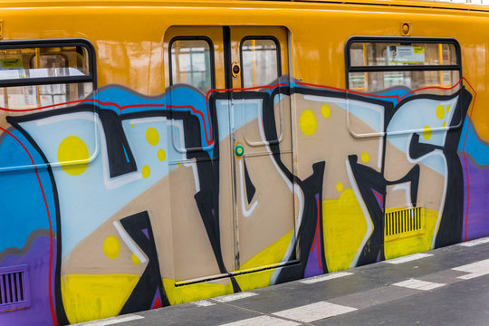  Subway train painted with graffiti is stationed in a metro station in Berlin - BERLIN / GERMANY - January  18, 2019