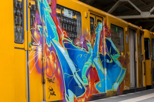  Subway train painted with graffiti is stationed in a metro station in Berlin - BERLIN / GERMANY - January  18, 2019