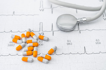 Stethoscope and capsule on electrocardiograph