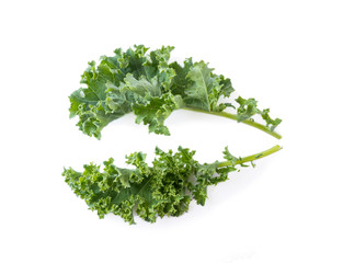 Obraz premium Kale leaves isolated on white background. Top view. Kale leaves with copy space for text. Herbs isolated on white. Kale on white background.