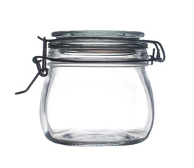 Empty glass jar with yoke lid on a white background close-up