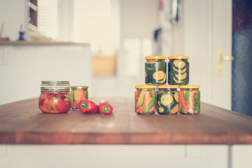 Variety of tasty vegetables in preserving glasses. Conservation of food.