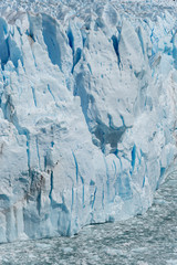 Fototapeta na wymiar Views of The Perito Moreno Glacier on a sunny day located in the Los Glaciares National Park. Argentina